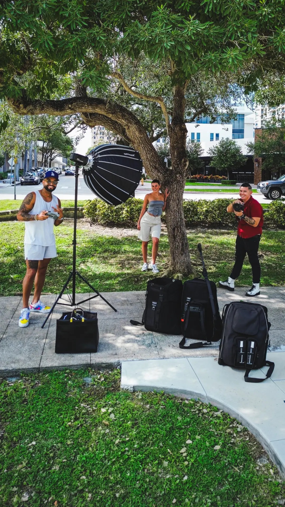 Lovos crew shooting outdoors under a tree in Miami