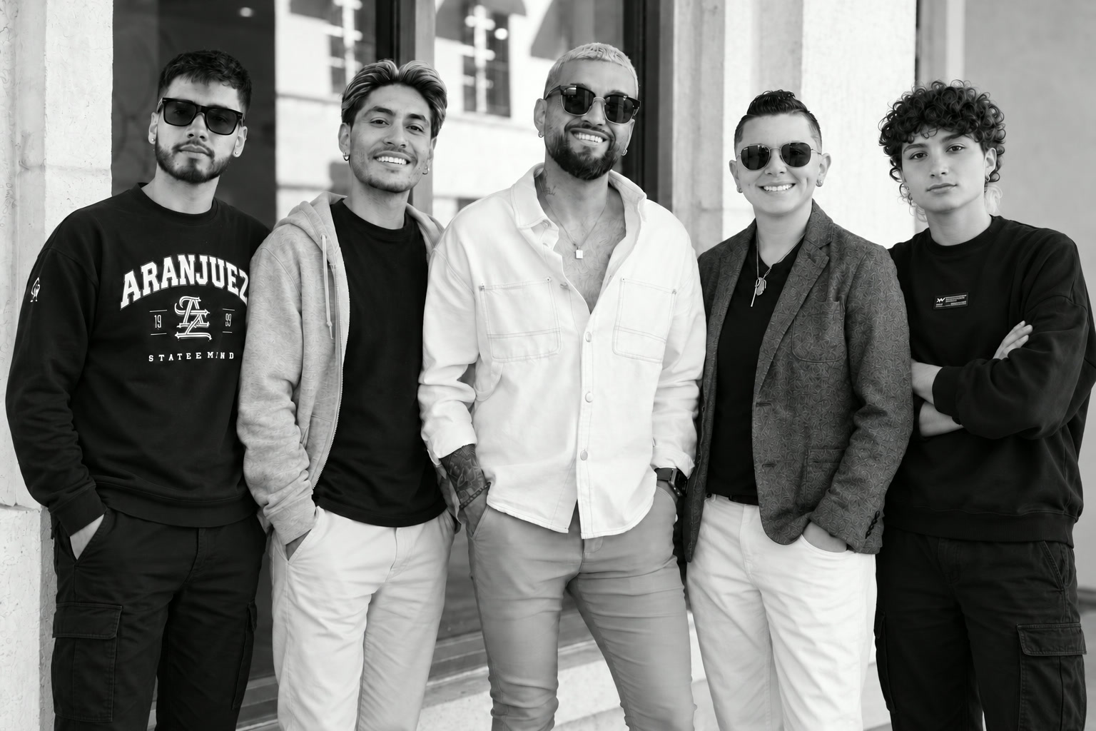 The Lovos Media Group team standing together outside their Coral Gables studio